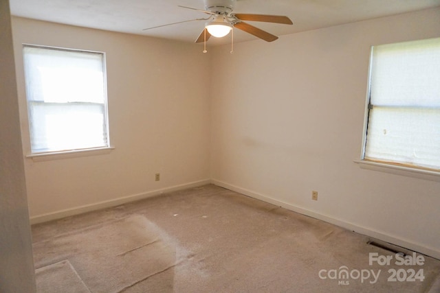 carpeted empty room with ceiling fan