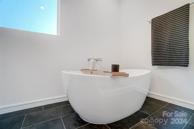 bathroom featuring a bathtub and tile patterned floors