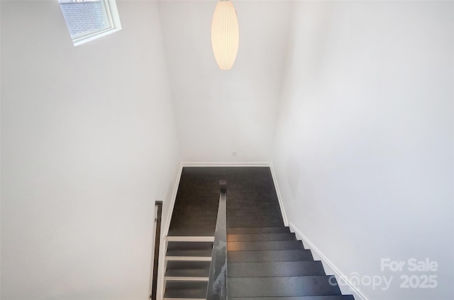 stairway with baseboards