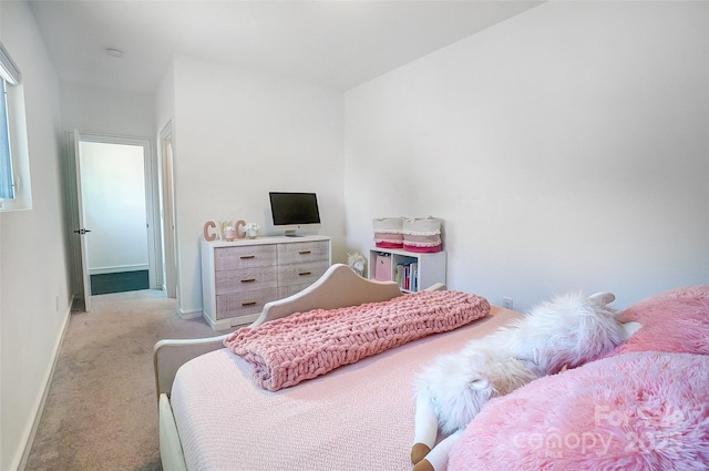 bedroom featuring carpet flooring and baseboards