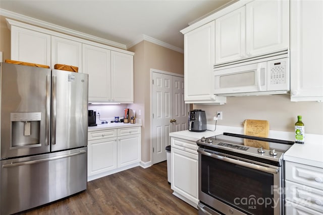 kitchen featuring ornamental molding, appliances with stainless steel finishes, dark hardwood / wood-style flooring, and white cabinets