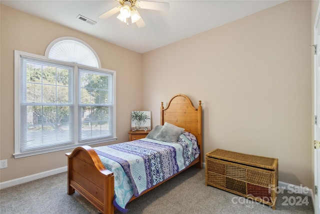 carpeted bedroom featuring ceiling fan