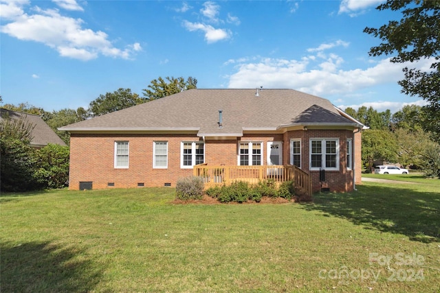 back of house with a lawn