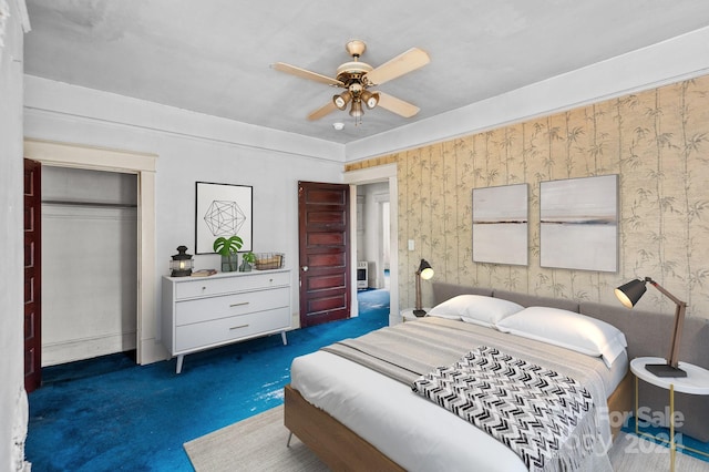 carpeted bedroom featuring a closet and ceiling fan