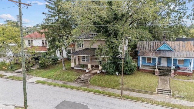 view of front of property with a front lawn and a porch