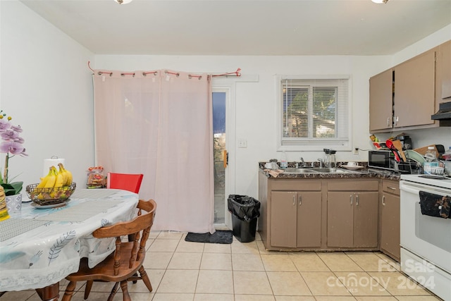 kitchen with light tile patterned flooring, extractor fan, white range with electric stovetop, and sink