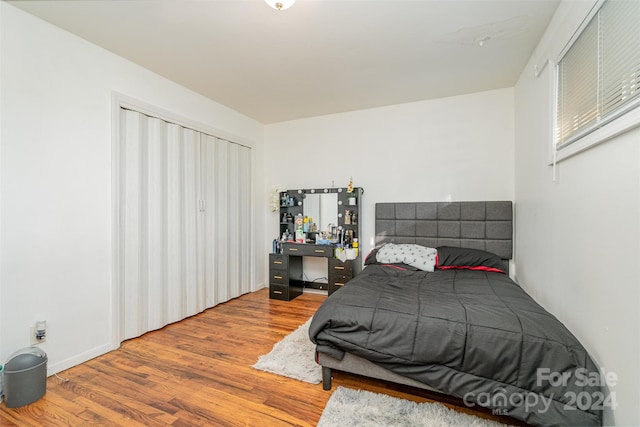 bedroom with wood-type flooring