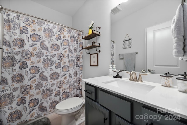 bathroom with vanity, tile patterned floors, toilet, and a shower with shower curtain