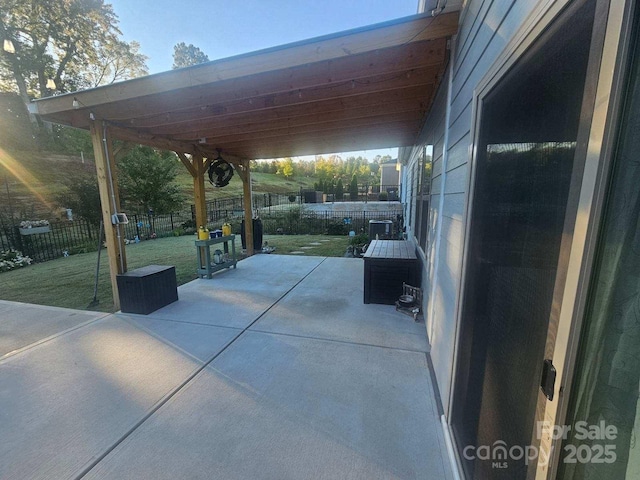 view of patio featuring a fenced backyard and a carport