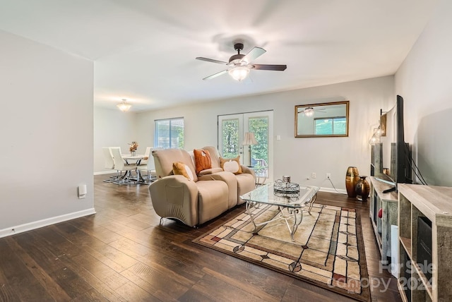 living room with ceiling fan and dark hardwood / wood-style floors