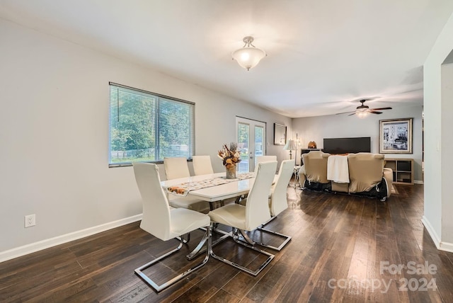 dining space with ceiling fan and dark hardwood / wood-style floors