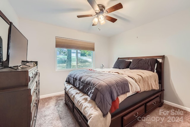 bedroom with light carpet and ceiling fan