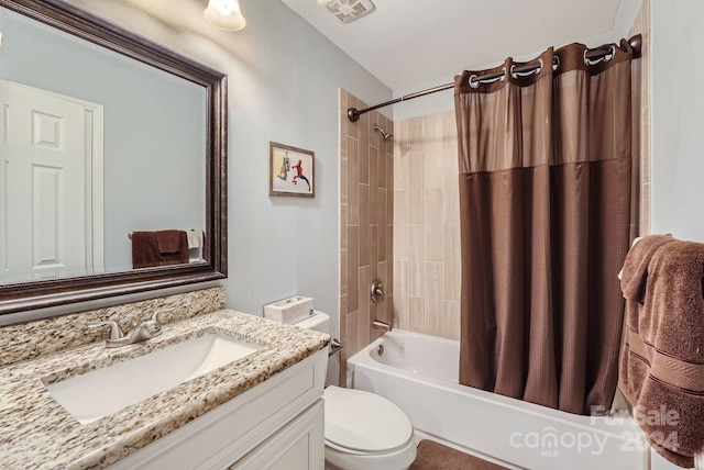 full bathroom with vanity, toilet, and shower / bath combo