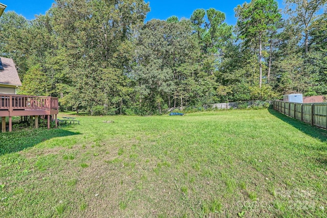 view of yard featuring a wooden deck