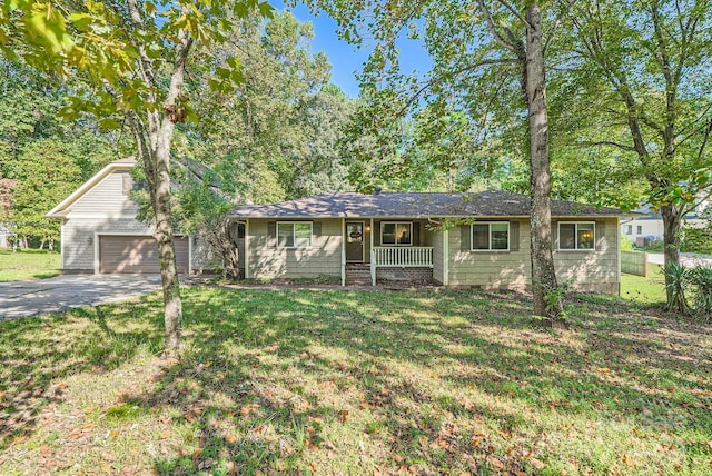 ranch-style house with a front yard, a garage, and a porch