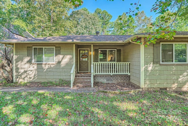 ranch-style home featuring a front yard