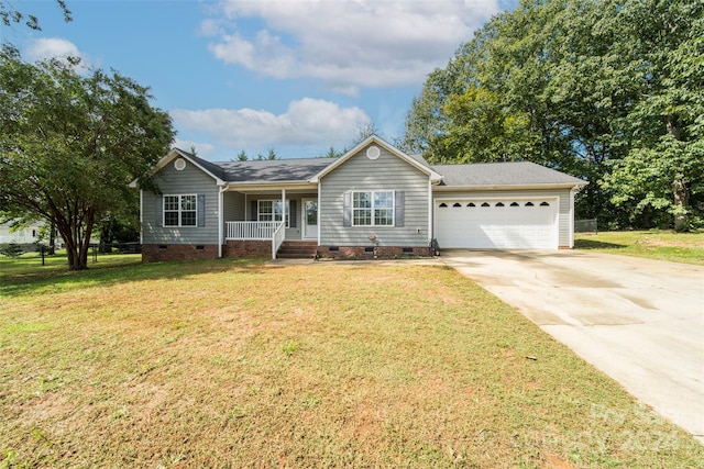 single story home with a garage, a front lawn, and a porch