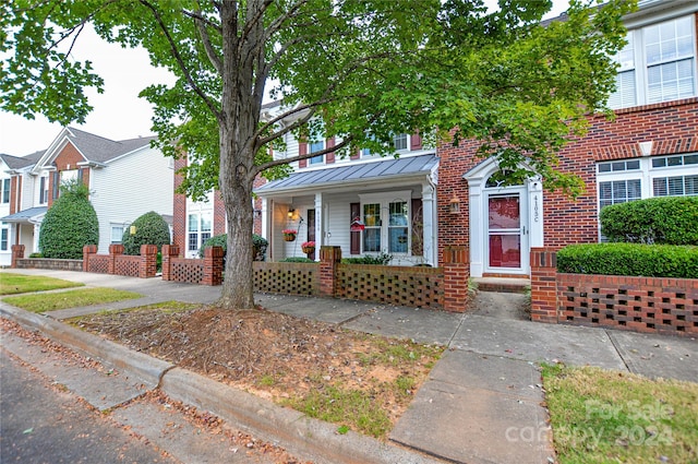 view of property featuring a porch