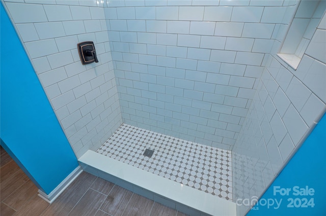 bathroom with a tile shower