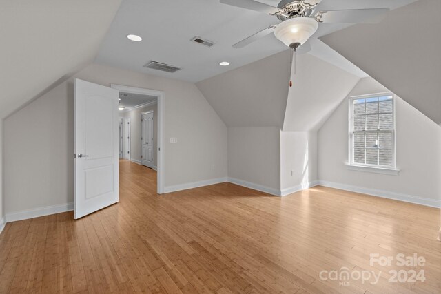 bonus room featuring ceiling fan, light hardwood / wood-style flooring, and vaulted ceiling