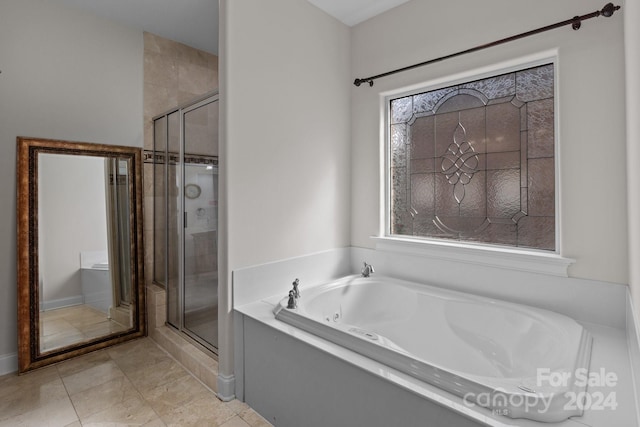 bathroom featuring shower with separate bathtub and tile patterned flooring