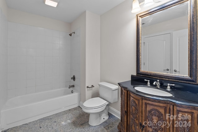 full bathroom featuring tiled shower / bath combo, vanity, and toilet