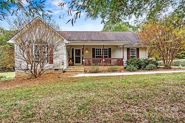 single story home with covered porch and a front lawn