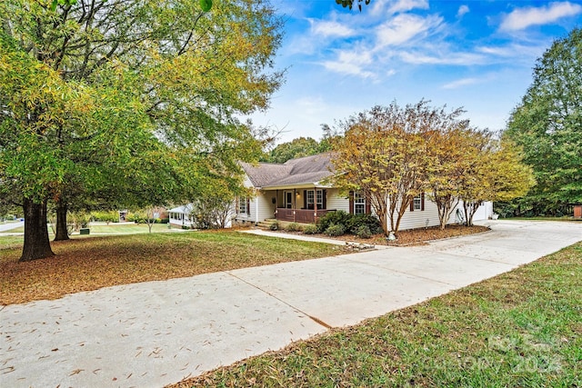 view of front of house featuring a front lawn and a porch