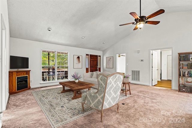 carpeted living room featuring ceiling fan, a textured ceiling, and high vaulted ceiling