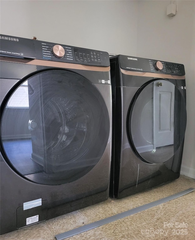 laundry area with separate washer and dryer