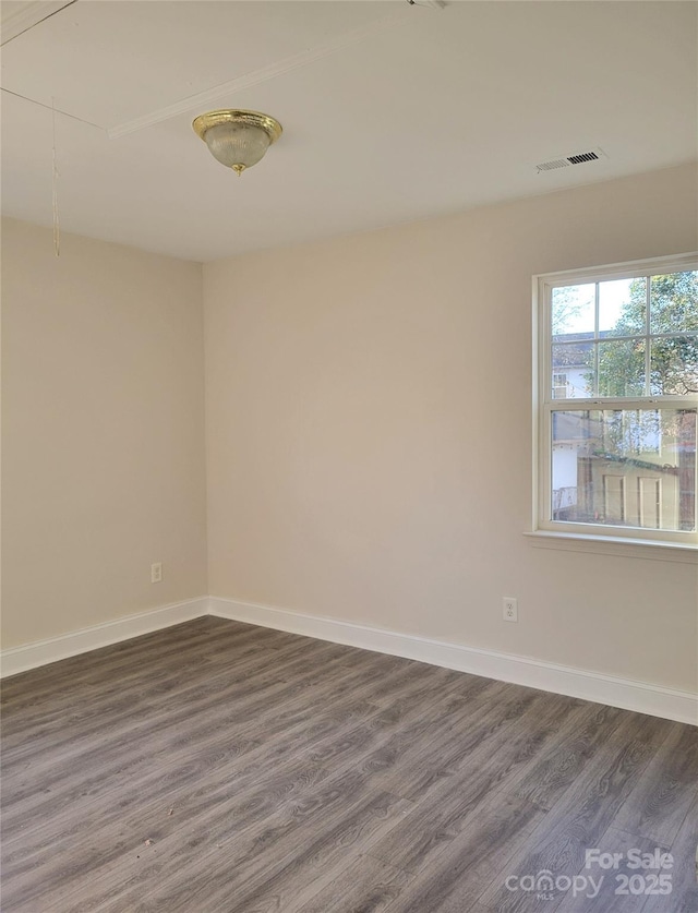 empty room with dark wood-type flooring