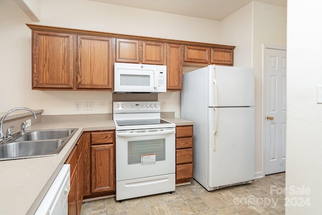 kitchen with sink and white appliances