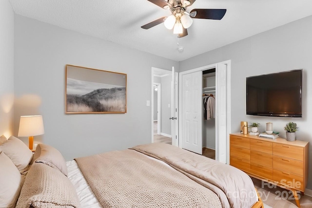 bedroom with ceiling fan and a closet