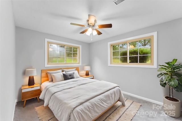 carpeted bedroom with ceiling fan