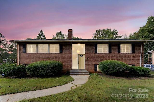 split foyer home with a yard