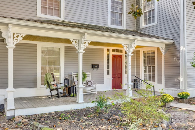 view of exterior entry featuring a porch