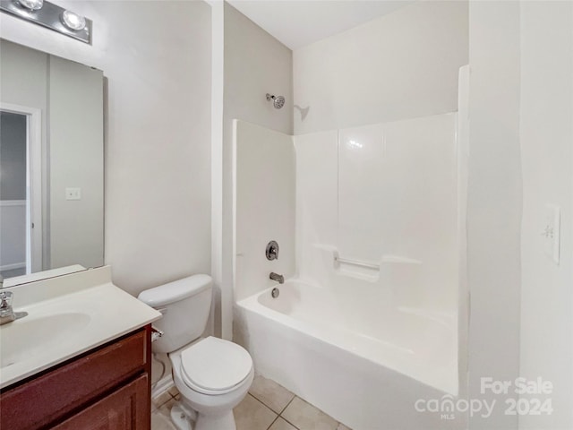 full bathroom with shower / tub combination, vanity, tile patterned flooring, and toilet