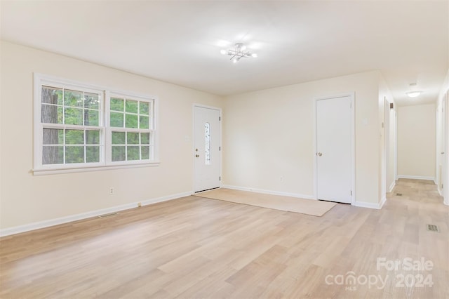 empty room with light wood-type flooring