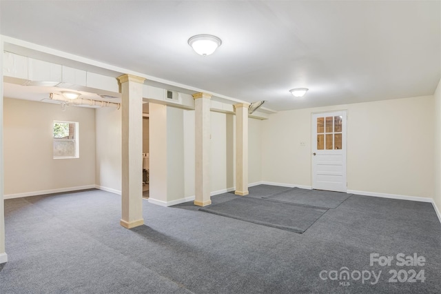 basement with dark colored carpet