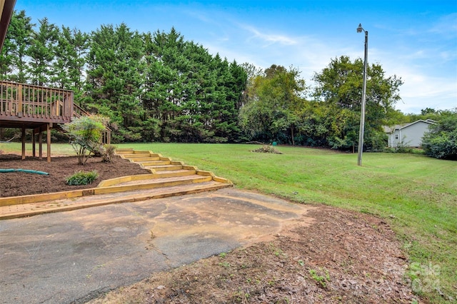 view of yard with a deck