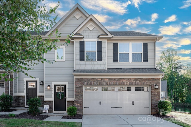 145 Beacon Dr Unit F, Mooresville, NC 28117 - craftsman inspired home with fence, stone siding, driveway, a garage, and a shingled roof