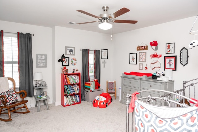 carpeted bedroom with ceiling fan