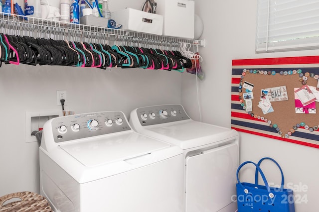 laundry room with washing machine and clothes dryer