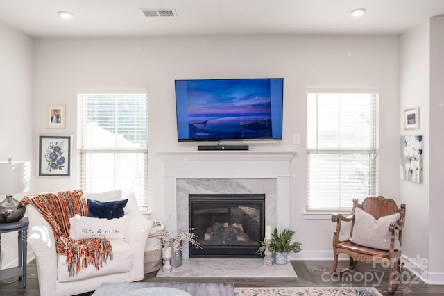 living room featuring hardwood / wood-style floors and a fireplace