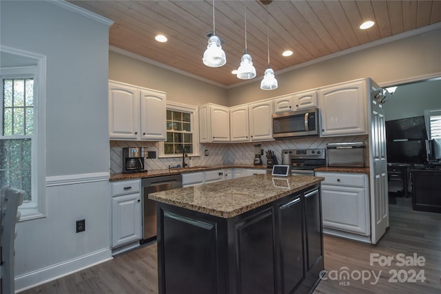 kitchen with appliances with stainless steel finishes, stone counters, wooden ceiling, white cabinets, and a center island