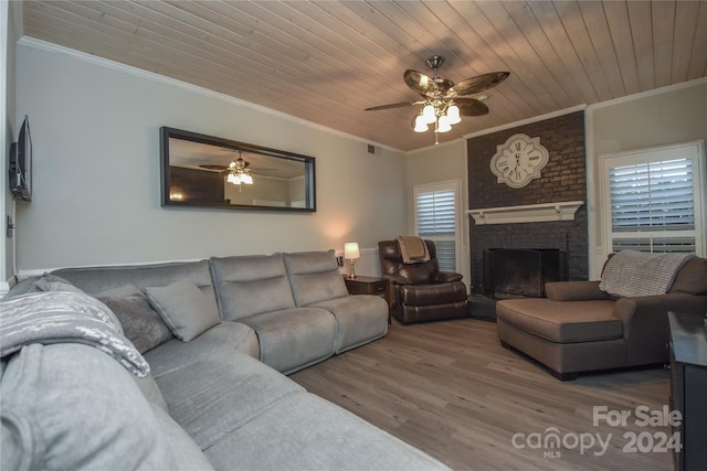 living room with hardwood / wood-style floors, wooden ceiling, and ornamental molding