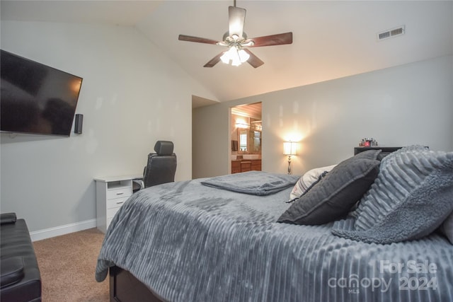 carpeted bedroom featuring ensuite bath, ceiling fan, and vaulted ceiling