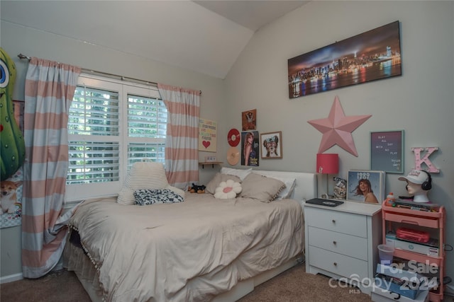 bedroom featuring lofted ceiling and carpet floors