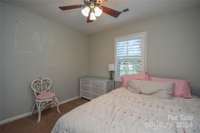 bedroom with ceiling fan and carpet floors