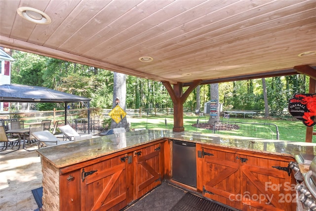 view of patio / terrace with a gazebo and a trampoline